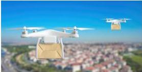 Hai drone đang vận chuyển hàng cứu trợ